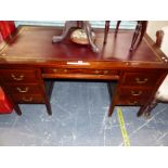 A MAHOGANY PEDESTAL DESK, THE TOP INSET WITH RED LEATHER, THE DRAWER ABOVE THE KNEEHOLE FLANKED BY