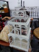 A WOODEN AND WIREWORK BIRD CAGE PAINTED WHITE