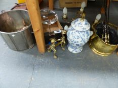 A PAIR OF BRASS FIRE DOGS, A BLUE AND WHITE VASE FORM LAMP, A BRASS HANGING CANDELABRA, A BRASS
