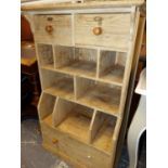 A PINE UNIT WITH SHELVING CENTRAL TO DRAWERS. W 68 x D 38 x H 109cms.
