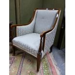 AN EDWARDIAN LINE INLAID MAHOGANY SHOWFRAME ARMCHAIR, THE RECTANGULAR BACK AND UNDERSIDE OF THE ARMS