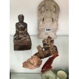 A BUDDISTIC SILVER WRAPPED SEATED DEITY, A CARVED MARBLE EXAMPLE, TWO SOAP STONE CARVINGS, AND AN