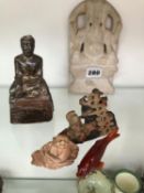 A BUDDISTIC SILVER WRAPPED SEATED DEITY, A CARVED MARBLE EXAMPLE, TWO SOAP STONE CARVINGS, AND AN