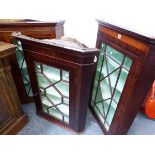 THREE ASTRAGAL GLAZED MAHOGANY CORNER CABINETS, EACH WITH PAINTED SHELF INTERIORS, THE TALLEST. W 79