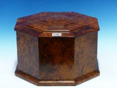 A BURR YEW WOOD OCTAGONAL BOX, THE STEPPED LID WITH A HINGE TO ONE SIDE. W 31.5cms