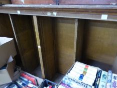 AN OAK OPEN BOOKCASE LACKING SHELVES.