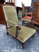 A VICTORIAN OAK SHOW FRAMED ARMCHAIR UPHOLSTERED IN PALE OLIVE VELVET, THE ARM FRONTS SUPPORTED ON