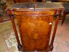 A VICTORIAN BURR WALNUT WRITING TABLE AND CANTERBURY, THE LEATHER INSET TOP OPENING OVER COLUMNS