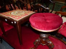 A VICTORIAN MAHOGANY PIANO STOOL, THE ROUND BUTTON UPHOLSTERED SEAT ADJUSTABLE ON THE FOLIATE CARVE