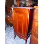 A SATIN WOOD CROSS BANDED MAHOGANY BEDSIDE CUPBOARD, THE DOOR ENCLOSING TWO SHELVES. W 51 x D 51 x H