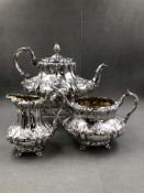 A VICTORIAN HALLMARKED SILVER THREE PEICE TEA SET WITH GILDED INTERIORS. ALL THREE PIECES DATED