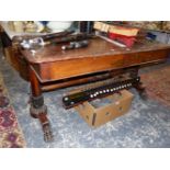AN EARLY VICTORIAN ROSEWOOD WRITING TABLE WITH TWO DRAWERS, THE OCTAGONAL COLUMNS ATR EACH END FL