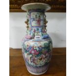 A PAIR OF 19th C. CANTON VASES PAINTED WITH RESERVES OF COURTIERS ON ONE SIDE OF THE BUDDHIST LION H
