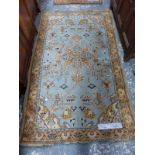 TWO ANTIQUE TURKISH OUSHAK RUGS. 204 x 122 cm AND 176 x 93cm (2)