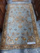 TWO ANTIQUE TURKISH OUSHAK RUGS. 204 x 122 cm AND 176 x 93cm (2)