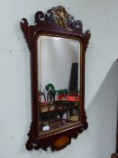 AN ANTIQUE 18th C. STYLE FRET FRAMED WALL MIRROR WITH PHOENIX SURMOUNT, W 51 X H 92cms.