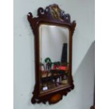 AN ANTIQUE 18th C. STYLE FRET FRAMED WALL MIRROR WITH PHOENIX SURMOUNT, W 51 X H 92cms.