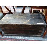 AN VINTAGE EBONISED PINE TWO HANDLED TRUNK. W 92 x D 46 x H 43cms.