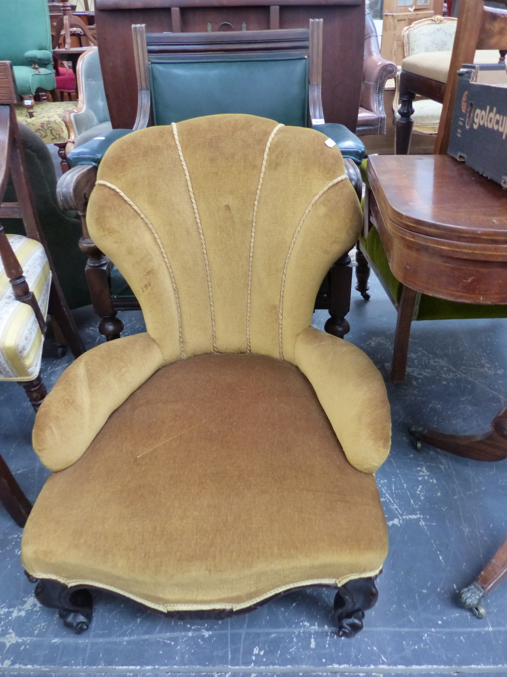 A VICTORIAN SHELL BACKED NURSING CHAIR UPHOLSTERED IN GOLDEN VELVET TOGETHER WITH A GREEN LEATHER
