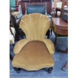 A VICTORIAN SHELL BACKED NURSING CHAIR UPHOLSTERED IN GOLDEN VELVET TOGETHER WITH A GREEN LEATHER