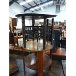 AN OAK TWO TIER CIRCULAR TABLE. Dia. 49cms. TOGETHER WITH AN EASTERN BRASS TRAY ON SIX LEGGED