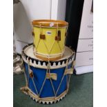 TWO DRUMS, THE SMALLER YELLOW SIDED, THE LARGER BLUE. Dia 45cms.