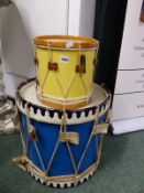 TWO DRUMS, THE SMALLER YELLOW SIDED, THE LARGER BLUE. Dia 45cms.