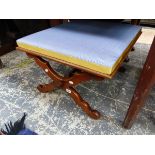 A MAHOGANY STOOL WITH THE UPHOLSTERED SEAT WITH X-SHAPED LEGS JOINED CENTRALLY BY A TURNED