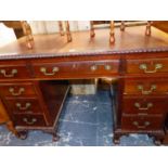 A MAHOGANY PEDESTAL DESK, THE LEATHER INSET TOP ABOVE A CENTRAL DRAWER FLANKED BY FOUR TO EACH