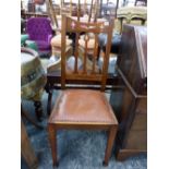 AN ARTS AND CRAFTS OAK CHAIR WITH PIERCED TOP RAIL, 3 BAR SPLAT, COPPER CLOSE NAILED LEATHER SEAT AN