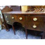 A GEORGIAN BOW FRONTED SIDEBOARD, THE CENTRAL DRAWER FLANKED BY TWO OTHERS AND A CELLARETTE DRAWER,