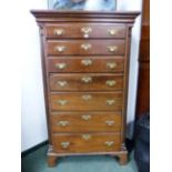 A GEORGIAN AND LATER IRISH MAHOGANY CHEST OF SEVEN GRADED DRAWERS BETWEEN QUARTER ROUND REEDED PILAS