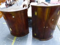 TWO MAHOGANY BOW FRONT CORNER CUPBOARDS, ONE WITH A SINGLE DOOR, THE LARGER WITH TWO. W 68 x D 47