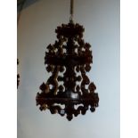 A PAIR OF 19TH CENTURY ROSEWOOD THREE SHELF CORNER BRACKETS ON PIERCED AND CARVED NEOGOTHIC BACK