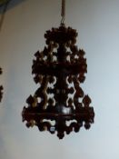 A PAIR OF 19TH CENTURY ROSEWOOD THREE SHELF CORNER BRACKETS ON PIERCED AND CARVED NEOGOTHIC BACK