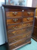 A GEORGIAN MAHOGANY CHEST OF FOUR SHORT DRAWERS ABOVE FOUR GRADED LONG DRAWERS ON BRACKET FEET. W