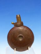 A ROUND COPPER POWDER FLASK WITH BRASS NOZZLE, A ROUNDEL RAISED TO EACH SIDE WITHIN A PELLET BAND.