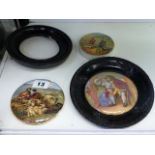 TWO ANTIQUE POT LIDS, UNCLE TOBY AND PEACE, AND ONE OTHER AND A FRAME.