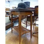 AN EDWARDIAN SATIN WOOD CROSS BANDED MAHOGANY SWIVEL FLAP TOP TABLE, THE LINE INLAID TAPERING SQUARE