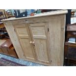 A VICTORIAN PINE CUPBOARD, THE DOORS EACH WITH TWO PANELS AND ENCLOSING SHELVES. W 140 x D 36 x H 1