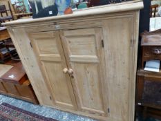 A VICTORIAN PINE CUPBOARD, THE DOORS EACH WITH TWO PANELS AND ENCLOSING SHELVES. W 140 x D 36 x H 1