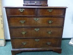 AN 18th C. HERRING BONE BANDED WALNUT CHEST OF TWO SHORT AND THREE LONG DRAWERS ON BRACKET FEET. W