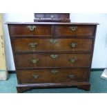 AN 18th C. HERRING BONE BANDED WALNUT CHEST OF TWO SHORT AND THREE LONG DRAWERS ON BRACKET FEET. W