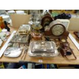TWO SILVER PLATED TUREENS, AN ARTS AND CRAFTS OIL LAMP WITH MESSENGER BURNER, FIVE VARIOUS CLOCKS, A