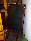 A VINTAGE PINE EASEL AND PINE FRAMED BLACK BOARD. OVERALL HEIGHT 192cms.