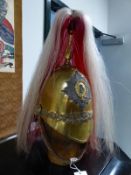 A 5TH DRAGOON GUARDS HELMET WITH RED AND WHITE HORSEHAIR PLUME.