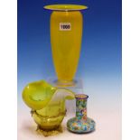 A YELLOW GLASS VASE WITH ITS RIM EDGE TRAILED IN BLUE. H 22.5cms. A VASELINE GLASS VASE. H 14cms.