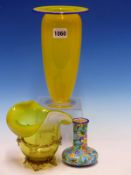 A YELLOW GLASS VASE WITH ITS RIM EDGE TRAILED IN BLUE. H 22.5cms. A VASELINE GLASS VASE. H 14cms.