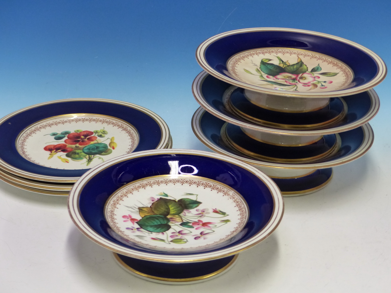 A LATE 19th C. ENGLISH PORCELAIN DESSERT SERVICE, EACH PIECE PRINTED AND PAINTED WITH FLOWERS WITHIN