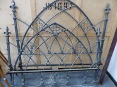 A WROUGHT IRON DOUBLE BED HEAD, FOOT AND SIDE BARS, THE OPEN WORKED GOTHIC ARCHES WITH QUATREFOILS